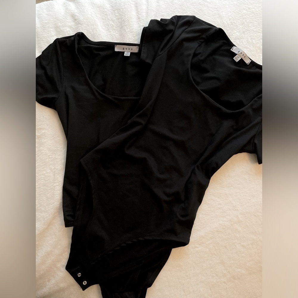2 black bodysuits